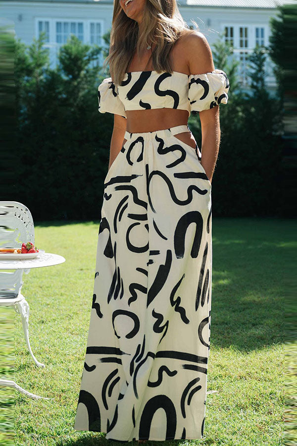 Deslumbra | Conjunto de top corto estampado con hombros descubiertos y falda maxi con bolsillos y aberturas