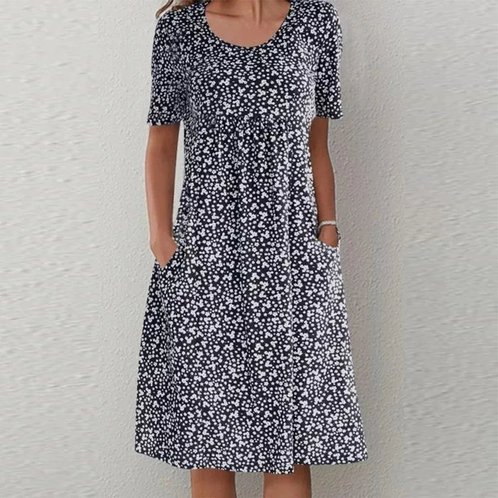 Deslumbra | Elegante vestido midi de manga corta con cuello redondo y bolsillos
