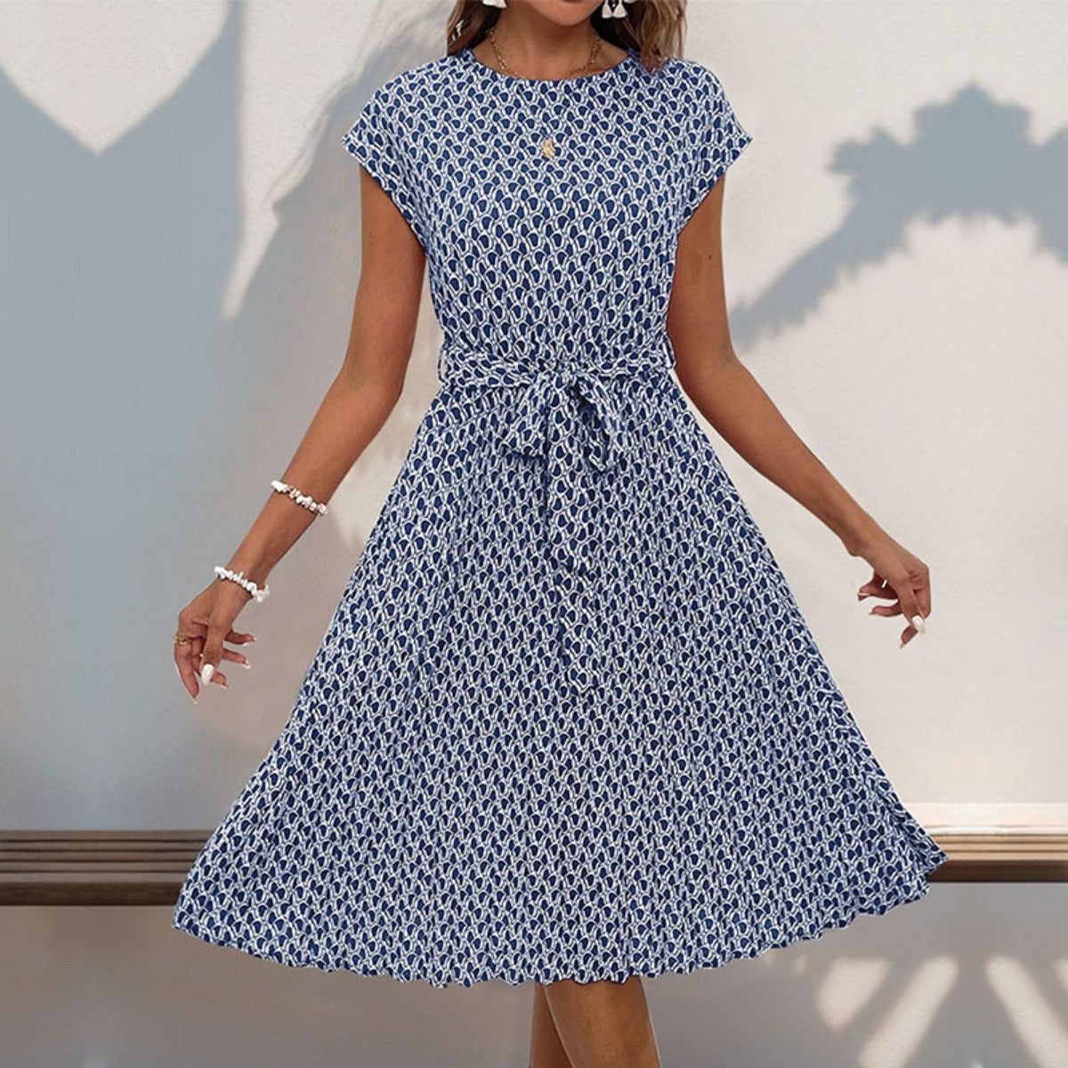 Deslumbra | Vestido plisado con estampado geométrico